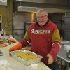 Lemoore Lion Mike Santamauro helps with dinner.